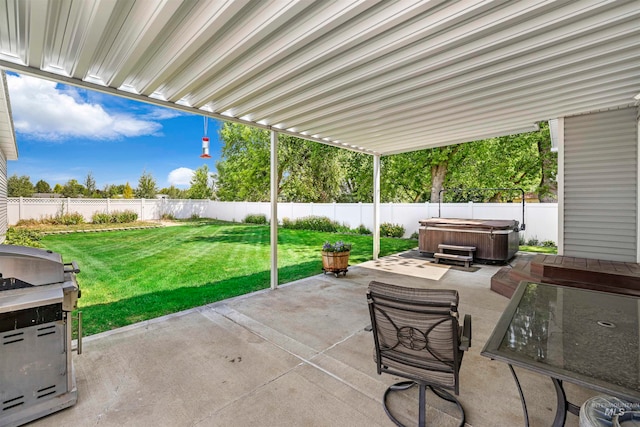 view of patio with grilling area and a hot tub