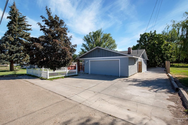 single story home featuring a garage