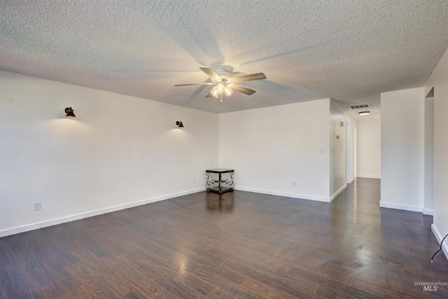 unfurnished room featuring a textured ceiling, ceiling fan, and dark hardwood / wood-style flooring