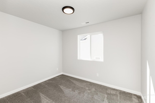 4429 N Magical Creek Ave, Meridian, ID 83646 - spare room featuring dark carpet and baseboards