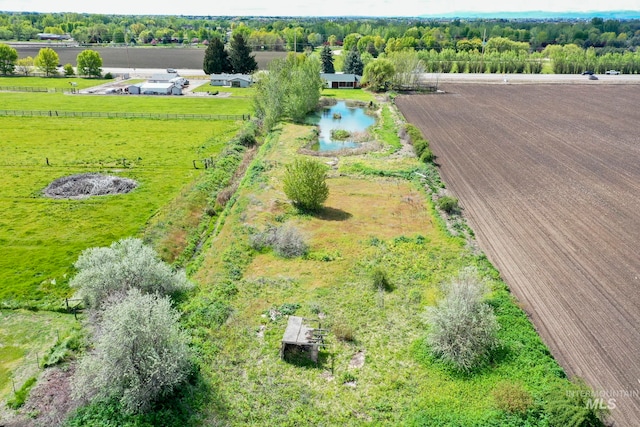 birds eye view of property featuring a rural view