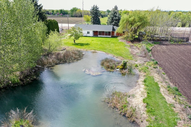 birds eye view of property featuring a water view