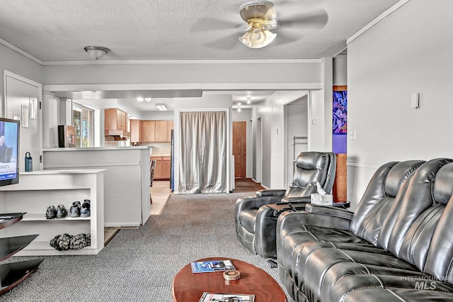 living room featuring a textured ceiling, ceiling fan, and light colored carpet