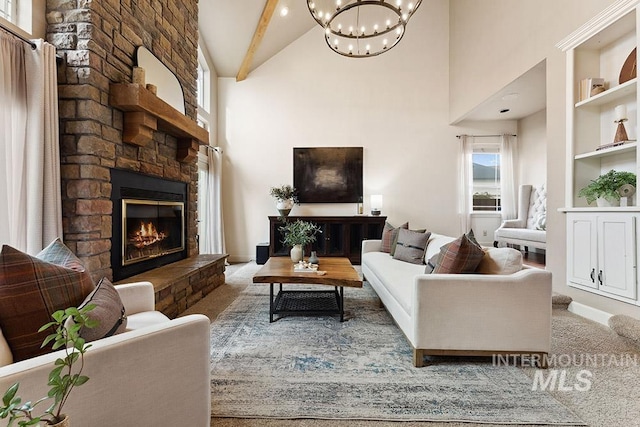 carpeted living room featuring high vaulted ceiling, plenty of natural light, beam ceiling, and a fireplace