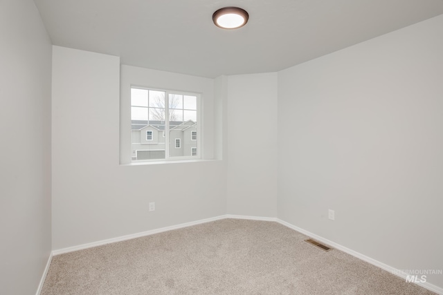 unfurnished room with carpet flooring