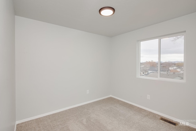 empty room featuring carpet floors