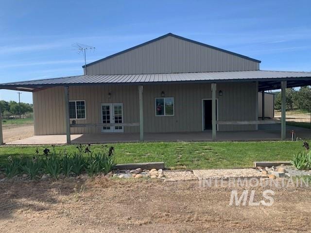 5720 SE 3rd Ave, New Plymouth, ID 83655 - back of house featuring french doors, metal roof, and a patio