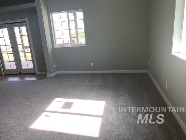 5720 SE 3rd Ave, New Plymouth, ID 83655 - carpeted empty room featuring french doors and baseboards