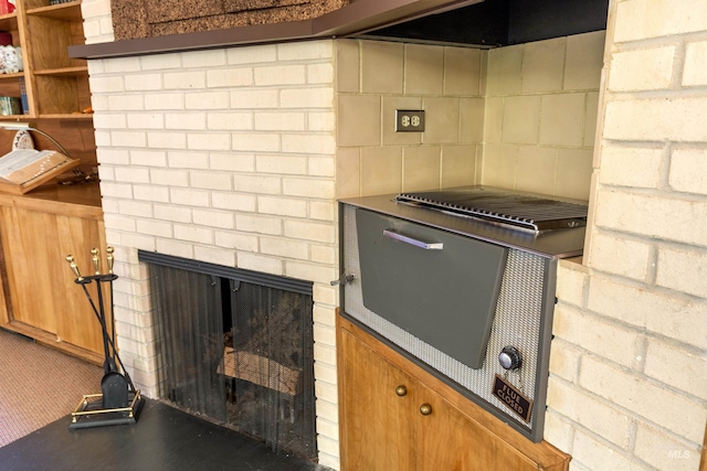 kitchen featuring brick wall