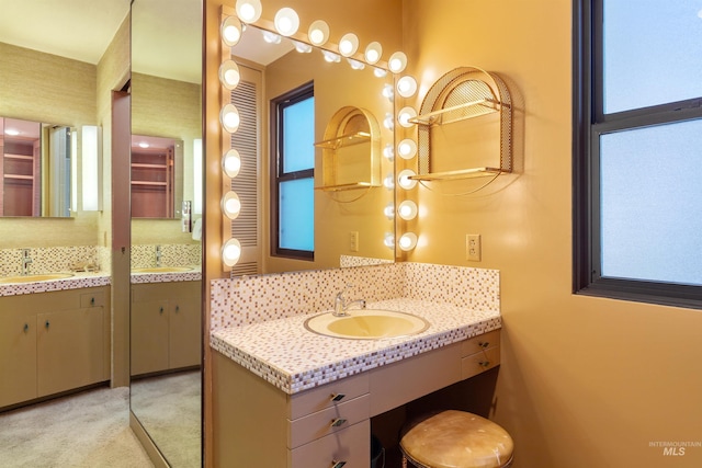 bathroom featuring plenty of natural light and vanity