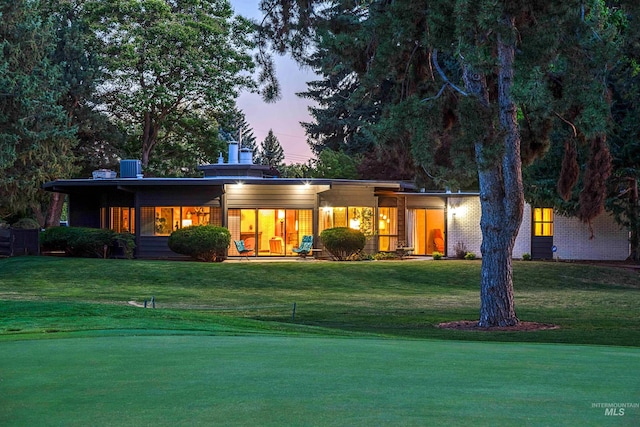 view of front of house with a lawn