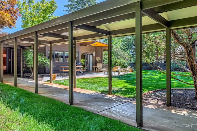 exterior space featuring a lawn and a patio area