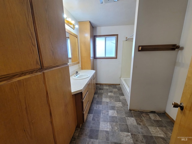 bathroom with vanity and  shower combination