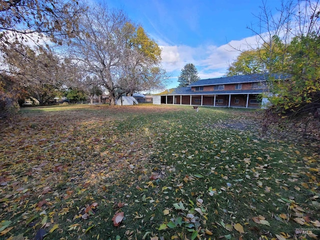 view of yard with a sunroom