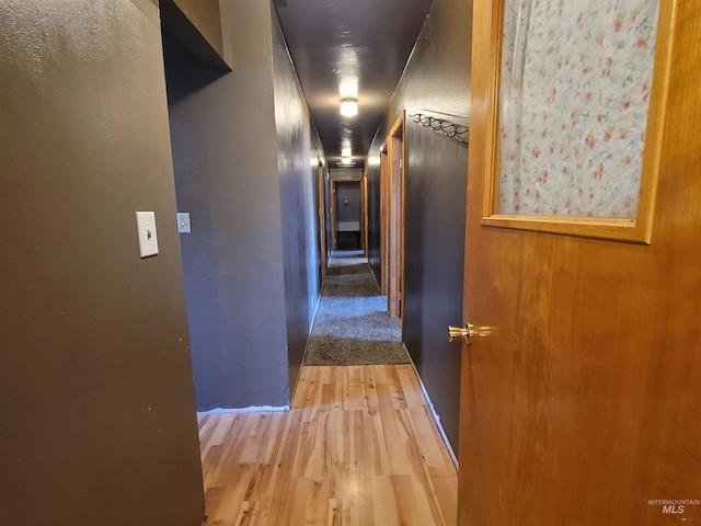 corridor featuring hardwood / wood-style floors