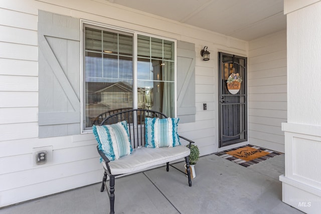 property entrance featuring covered porch