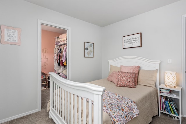 bedroom with baseboards and carpet floors