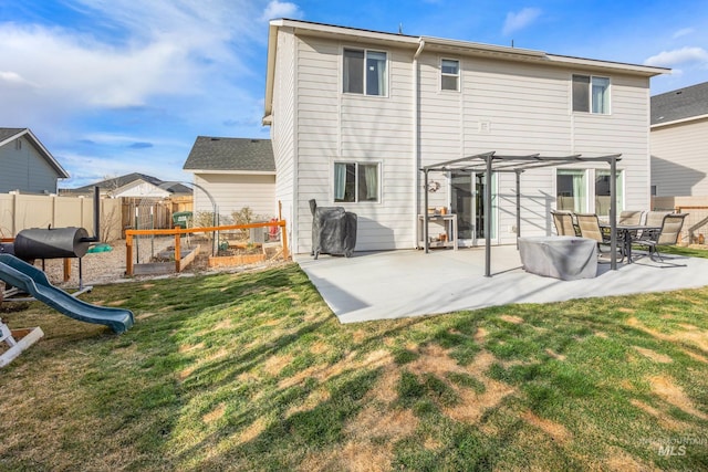 back of property with a pergola, a playground, fence, a yard, and a patio area