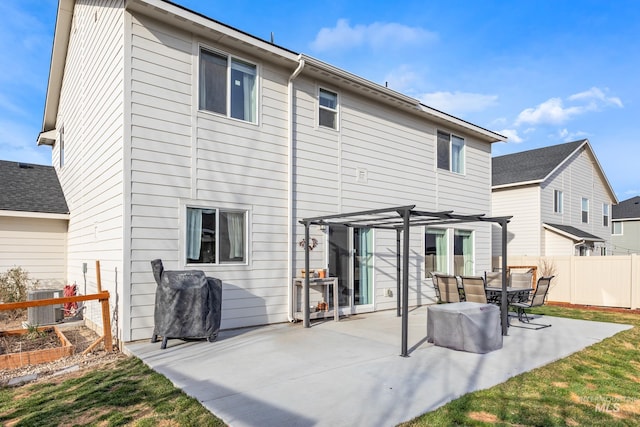 back of property with a patio area, central air condition unit, a pergola, and fence