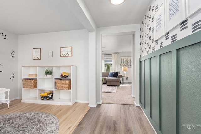 entrance foyer featuring baseboards and wood finished floors