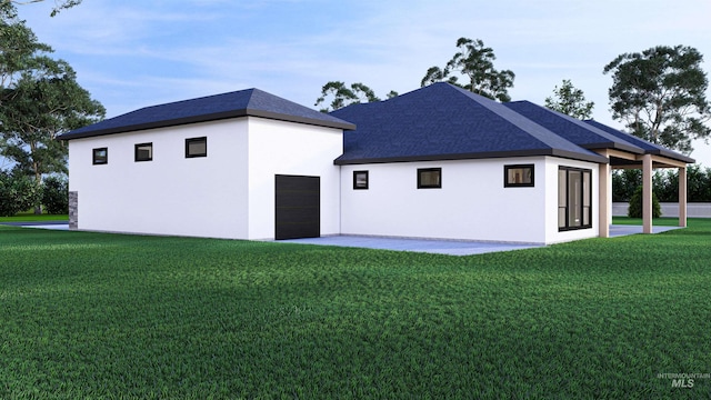 22909 Cirrus Vw, Caldwell, ID 83709 - rear view of house with a yard, stucco siding, and a garage