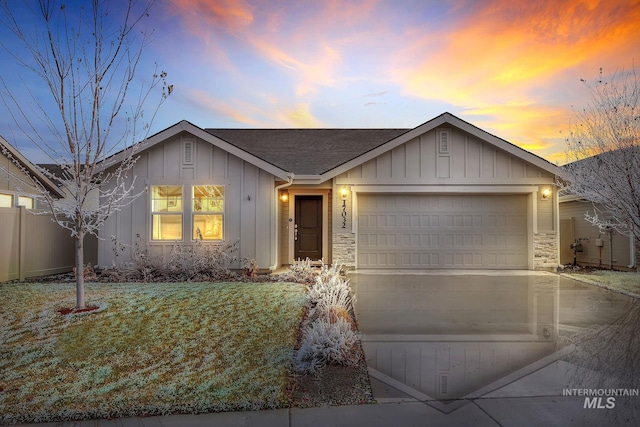 ranch-style house featuring a garage, roof with shingles, board and batten siding, and driveway