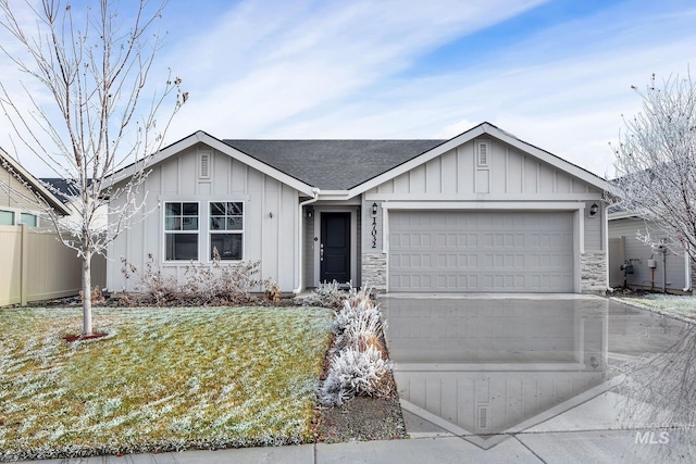 single story home with fence, driveway, an attached garage, a shingled roof, and board and batten siding