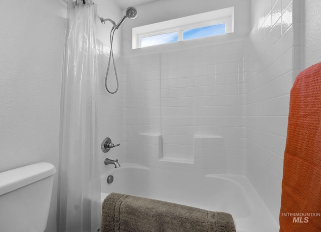 full bath with toilet and shower / bath combo