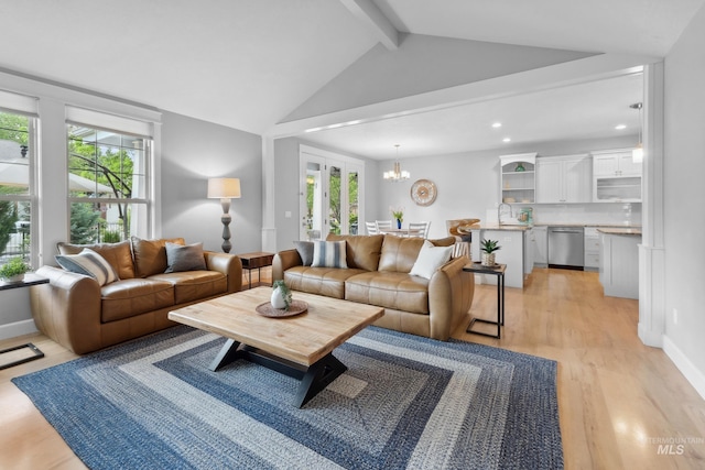 living area with light wood finished floors, a chandelier, recessed lighting, and baseboards
