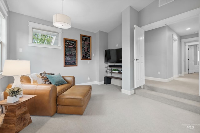 living room with carpet flooring and baseboards