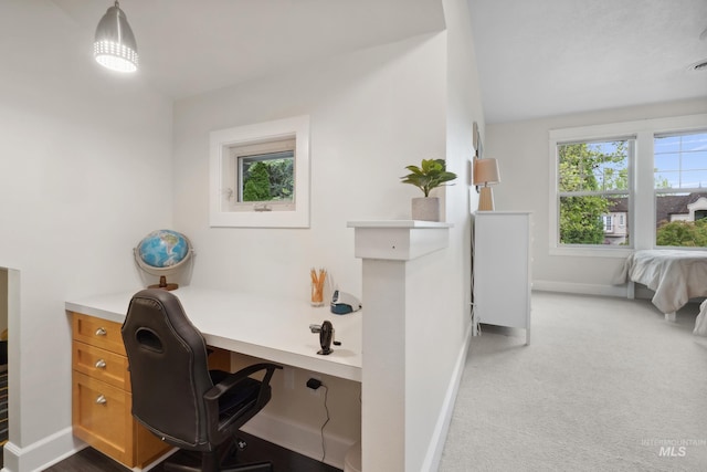 carpeted office with baseboards