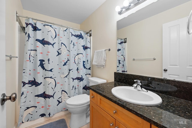 bathroom with toilet, vanity, a shower with shower curtain, and tile patterned floors