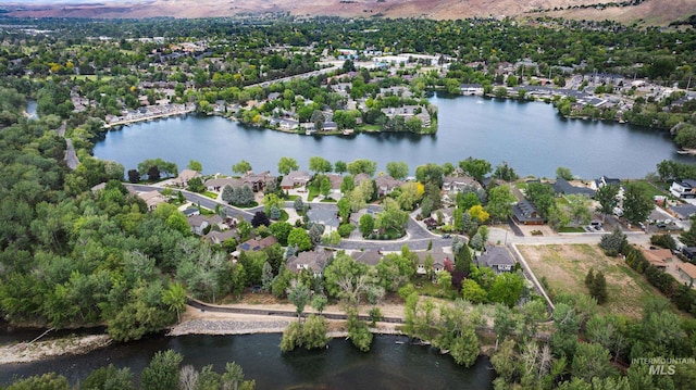 aerial view of residential area with a large body of water