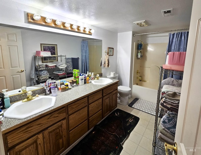 full bathroom featuring tile patterned flooring, shower / bath combination with curtain, a textured ceiling, toilet, and vanity