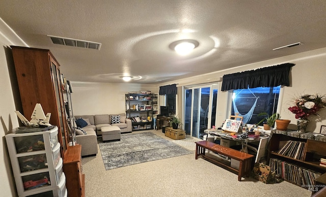 living room with carpet floors and a textured ceiling