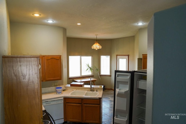 1011 N Spirea, Boise, ID 83713 - kitchen with dishwasher, a peninsula, light countertops, tile patterned floors, and recessed lighting