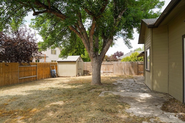 1011 N Spirea, Boise, ID 83713 - fenced backyard featuring a storage unit