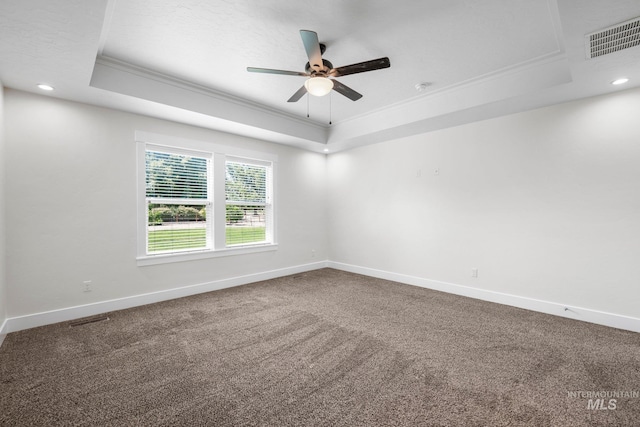 7253 River View Dr, Marsing, ID 83639 - carpeted spare room featuring a tray ceiling, ornamental molding, a ceiling fan, and recessed lighting