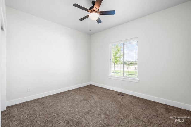 7253 River View Dr, Marsing, ID 83639 - spare room featuring dark carpet and a ceiling fan