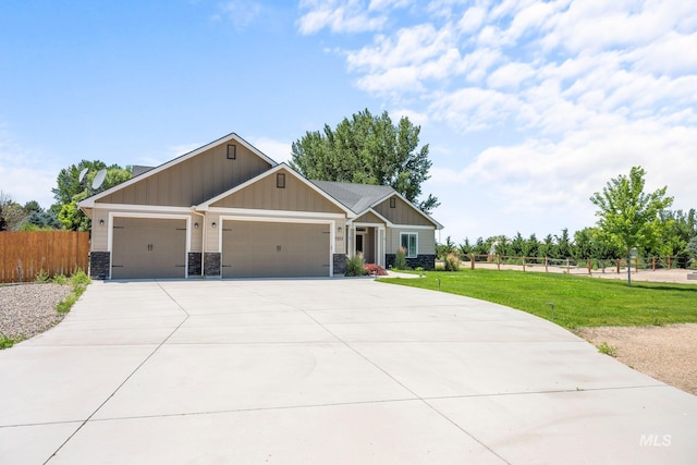 7253 River View Dr, Marsing, ID 83639 - craftsman-style house featuring an attached garage, driveway, board and batten siding, and stone siding