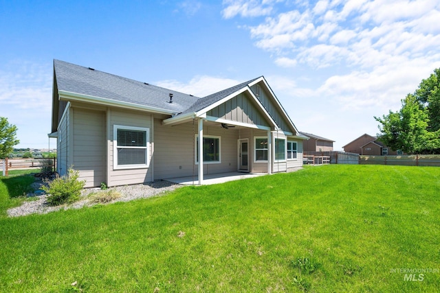 7253 River View Dr, Marsing, ID 83639 - rear view of property featuring board and batten siding, a patio, ceiling fan, and roof with shingles