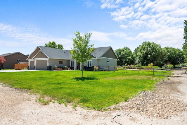 7253 River View Dr, Marsing, ID 83639 - view of front of home with a garage, concrete driveway, and board and batten siding