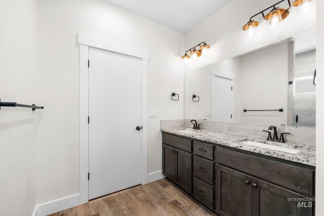 7253 River View Dr, Marsing, ID 83639 - bathroom with wood finished floors and double vanity