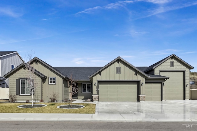 view of front of property featuring an attached garage, board and batten siding, and driveway