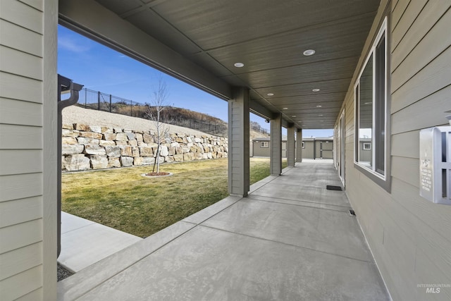 view of patio featuring fence