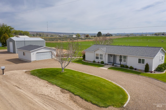 ranch-style house with a garage and a front lawn