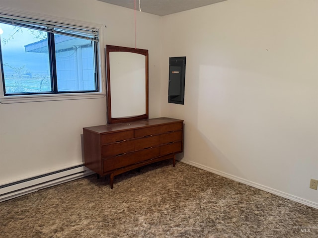 bedroom with carpet, electric panel, and baseboard heating