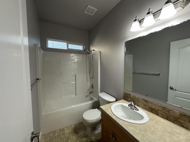 full bathroom featuring toilet, vanity, and bathing tub / shower combination