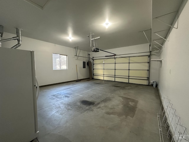 garage with white refrigerator and a garage door opener