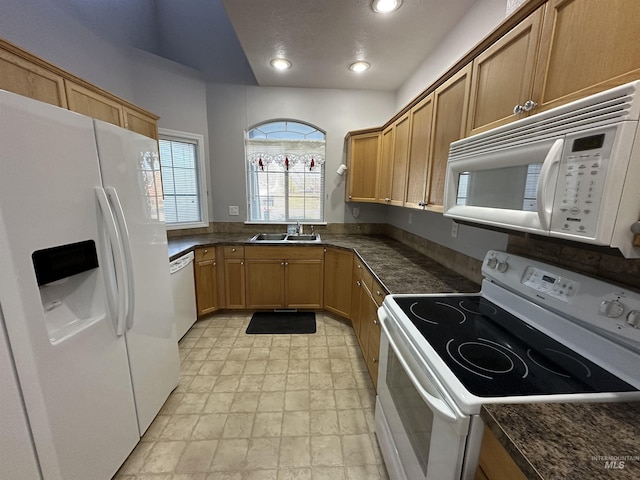 kitchen with sink and white appliances